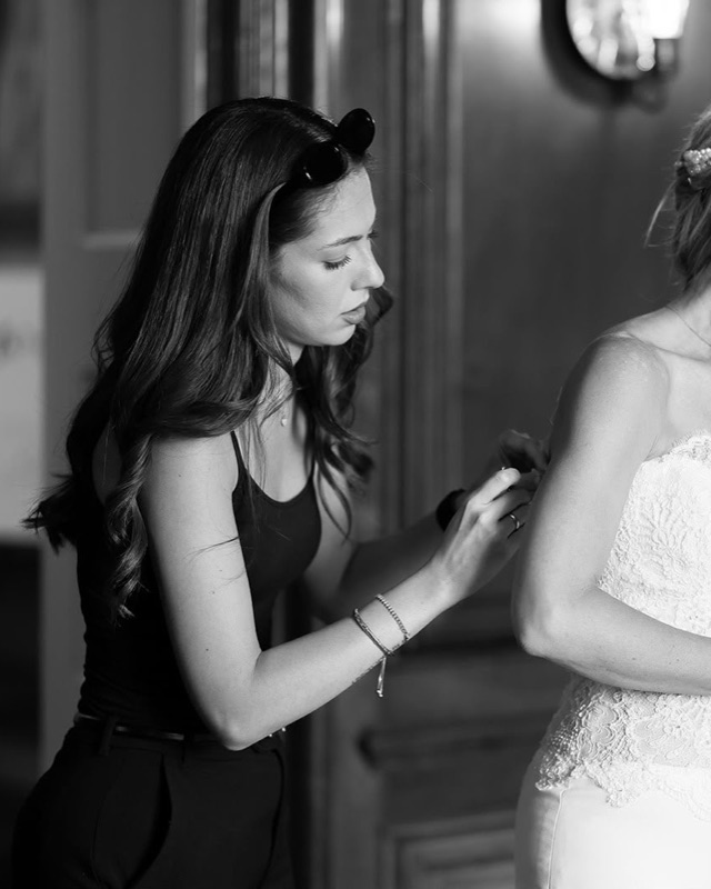 Alba helping a bride into her wedding dress on the morning of her wedding
