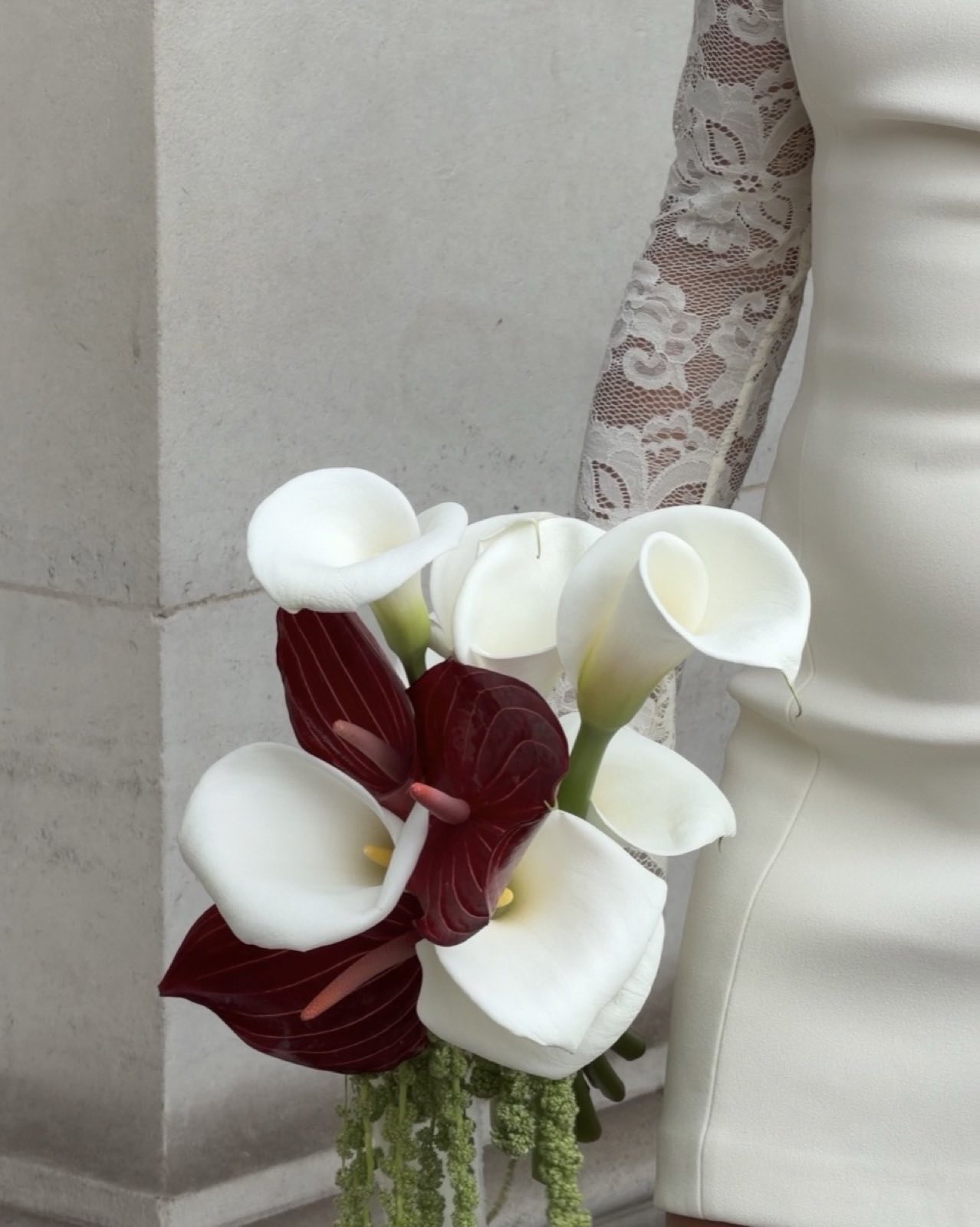 Bridal bouquet of white and burgundy calla lilies