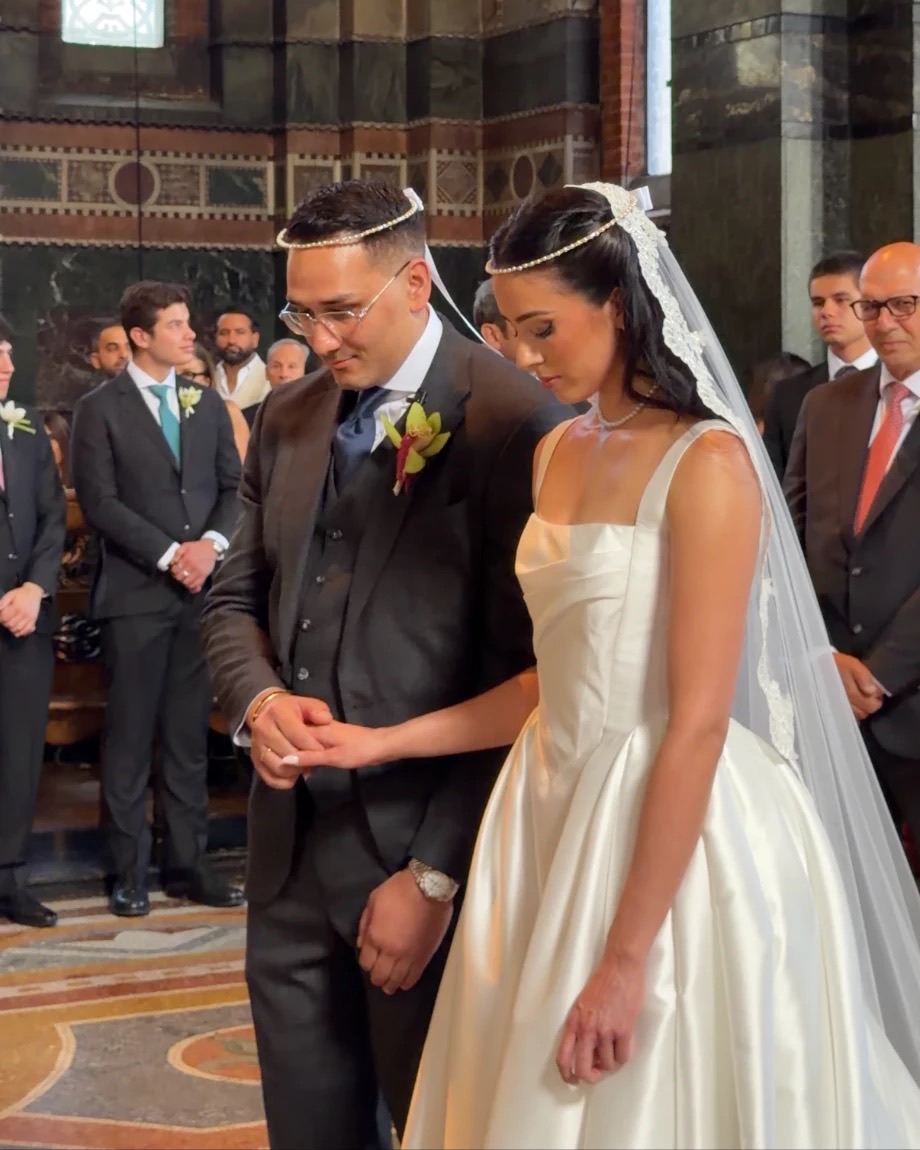 Bride and groom wearing stefana crowns at their Greek Orthodox wedding at St Sophia's Cathedral, London