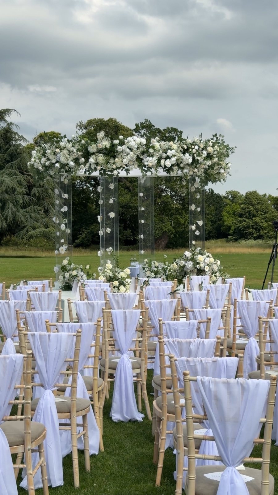 Outdoor wedding ceremony set up with flowers and chairs
